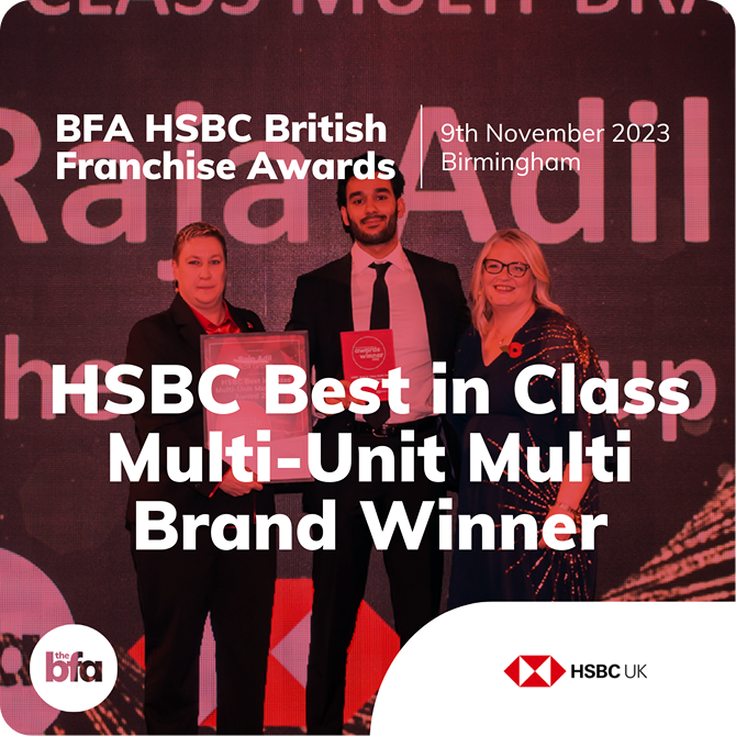 Three people stand on stage holding an award certificate at the BFA HSBC British Franchise Awards. Text reads: HSBC Best in Class Multi-Unit Multi Brand Winner, 9th November 2023, Birmingham. HSBC and BFA logos are visible.